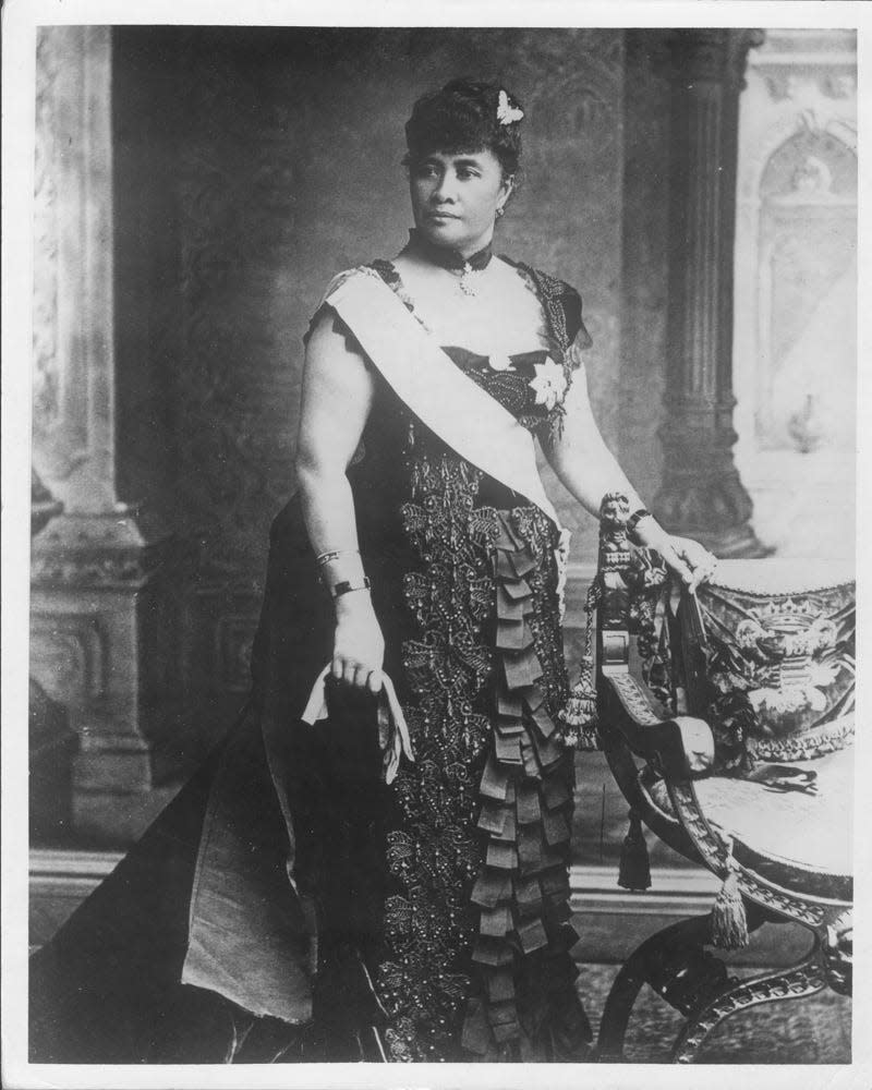 An image of Queen Liliu‘okalani wearing the famous black ribbon gown for the Queen's Jubilee in London, 1887.
