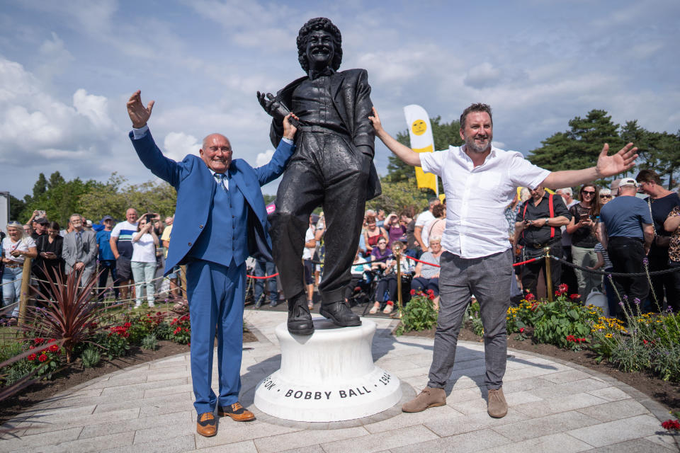 Tommy Cannon andLee Mac stand with Bobbyâ€™s statue. The unveiling of the Bobby Ball statue at Lowther Gardens, Lytham, Lancashire, August 28 2022. 