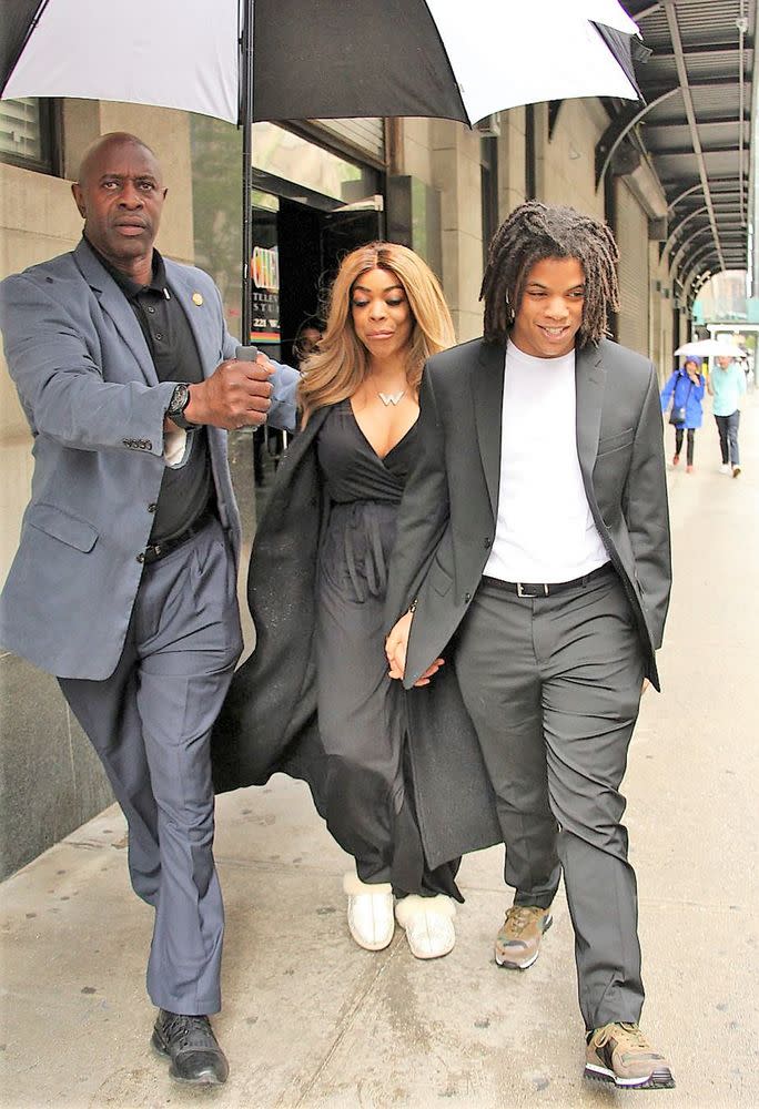 Wendy Williams and son Kevin Hunter Jr smile in the rain on their way to a Washington DC gala after arrest last night of Kevin Jr due to a fight with Kevin Hunter Sr. 23 May 2019 | MEGA