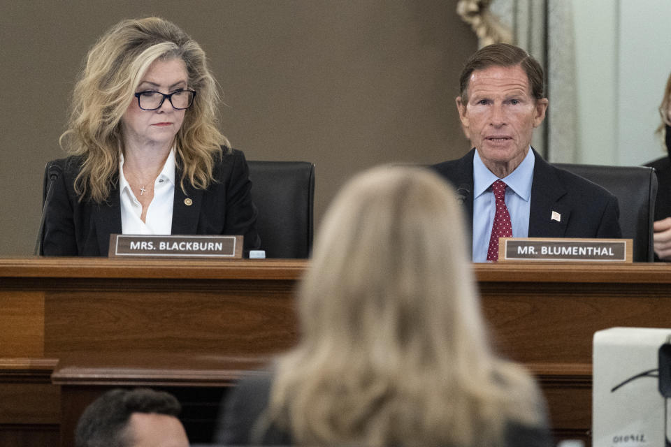 FILE - Sen. Marsha Blackburn, R-Tenn., left, and Sen. Richard Blumenthal, D-Conn., right speak to former Facebook data scientist Frances Haugen, center, during a hearing of the Senate Commerce, Science, and Transportation Subcommittee on Consumer Protection, Product Safety, and Data Security, Oct. 5, 2021, in Washington. Legislation by Blumenthal and Blackburn approved by the Senate Commerce Committee last year would require social media companies to be more transparent about their operations and enable child safety settings by default. (AP Photo/Alex Brandon, File)