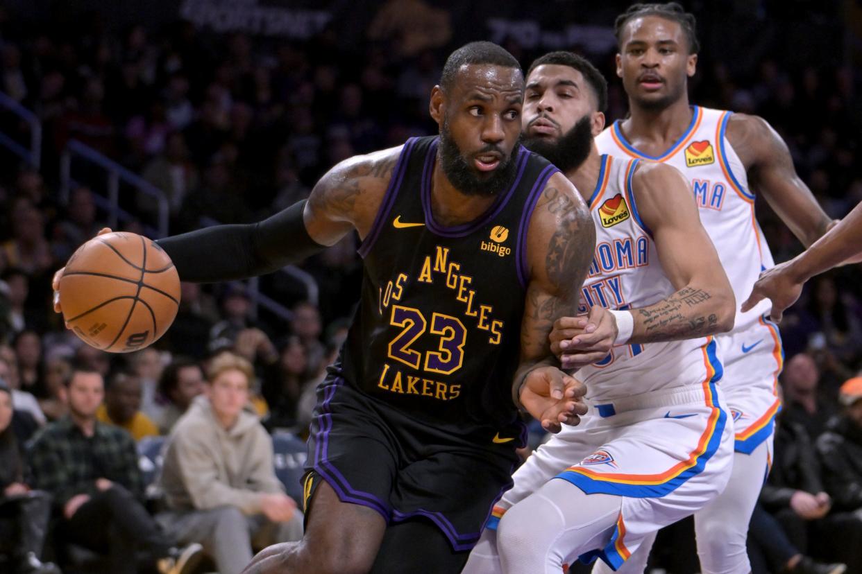 Jan 15, 2024; Los Angeles, California, USA; Los Angeles Lakers forward LeBron James (23) drives past Oklahoma City Thunder guard Cason Wallace (22) in the first half at Crypto.com Arena. Mandatory Credit: Jayne Kamin-Oncea-USA TODAY Sports