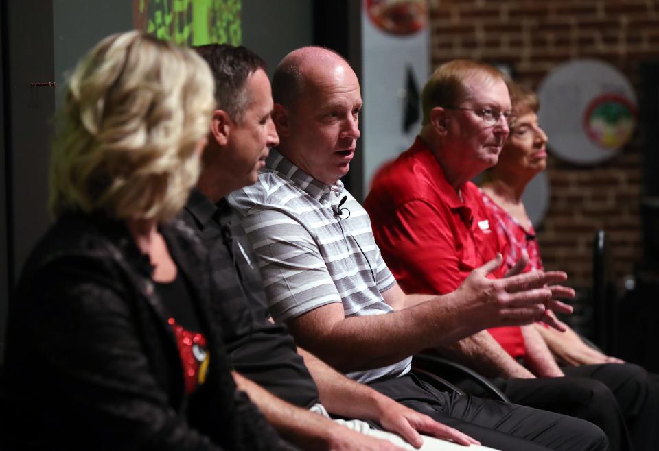 New U of L head football coach Jeff Brohm, center, made remarks as he was joined (L-R) by sister Kim, brother Greg, his dad Oscar and mom Donna during a Brohm family panel discussion at the Frazier History Museum in Louisville, Ky. on June 6, 2023.