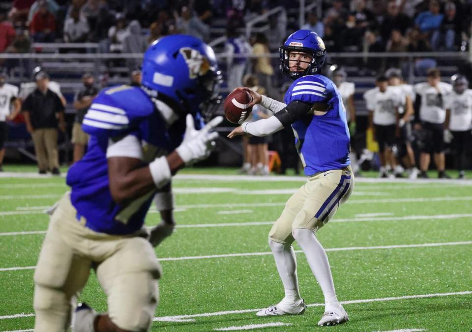 Indian Land quarterback Jaxon Scheidt looks down the field Friday, Sept. 29, 2023.