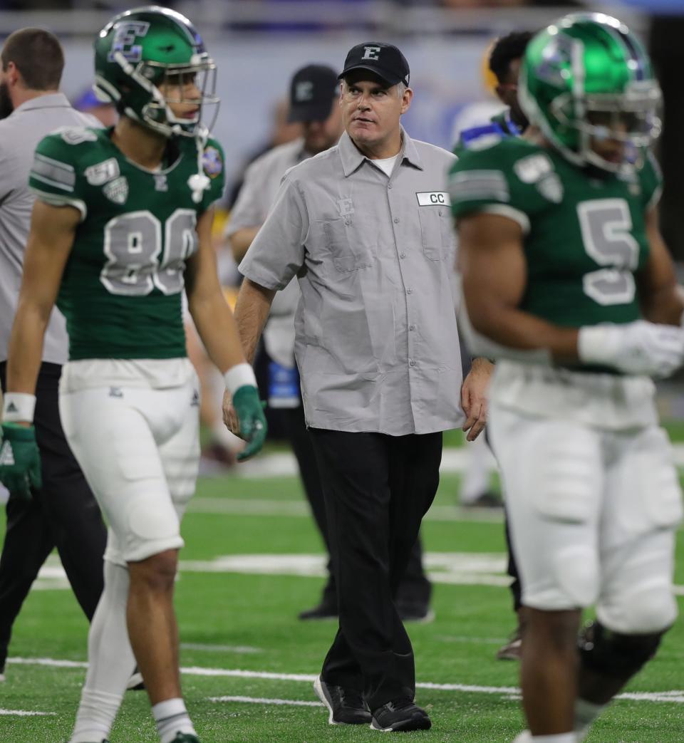 Eastern Michigan Eagles coach Chris Creighton watches his team warm up before action against Pittsburgh in the Quick Lane Bowl, Thursday, Dec. 26, 2019 at Ford Field in Detroit.