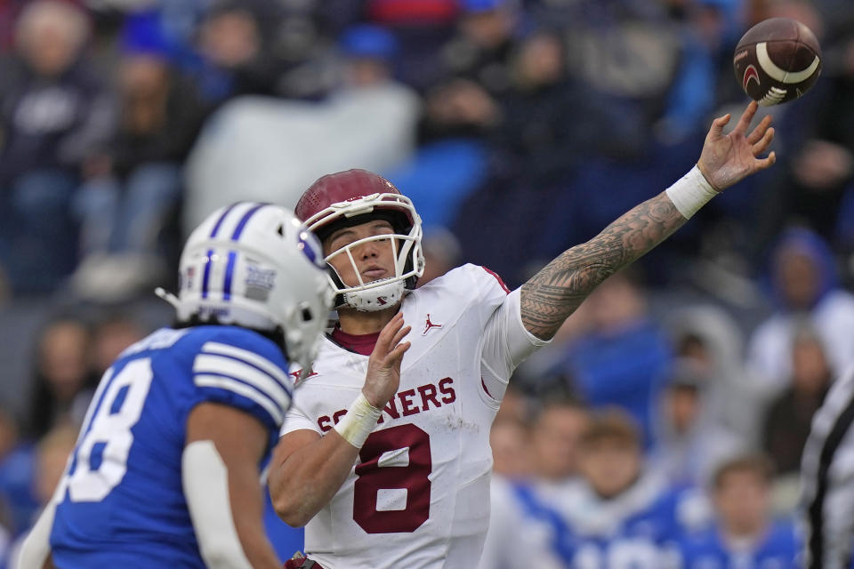 Oklahoma quarterback Dillon Gabriel (8) throws during the first half of an NCAA college football game against BYU, Saturday, Nov. 18, 2023, in Provo, Utah. (AP Photo/Rick Bowmer)