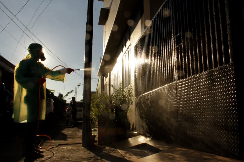 A worker spray disinfectant in a residential area, to prevent the spread of coronavirus disease (COVID-19)