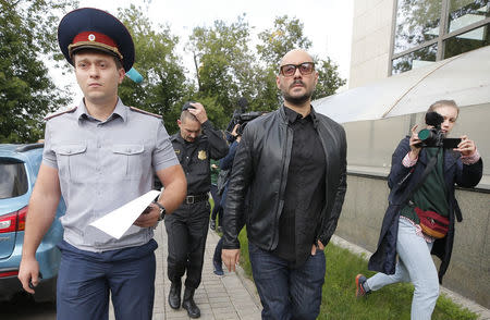 Russian theatre director Kirill Serebrennikov (2nd R), who was accused of embezzling state funds and placed under house arrest, is escorted after a court hearing in Moscow, Russia September 4, 2017. REUTERS/Maxim Shemetov