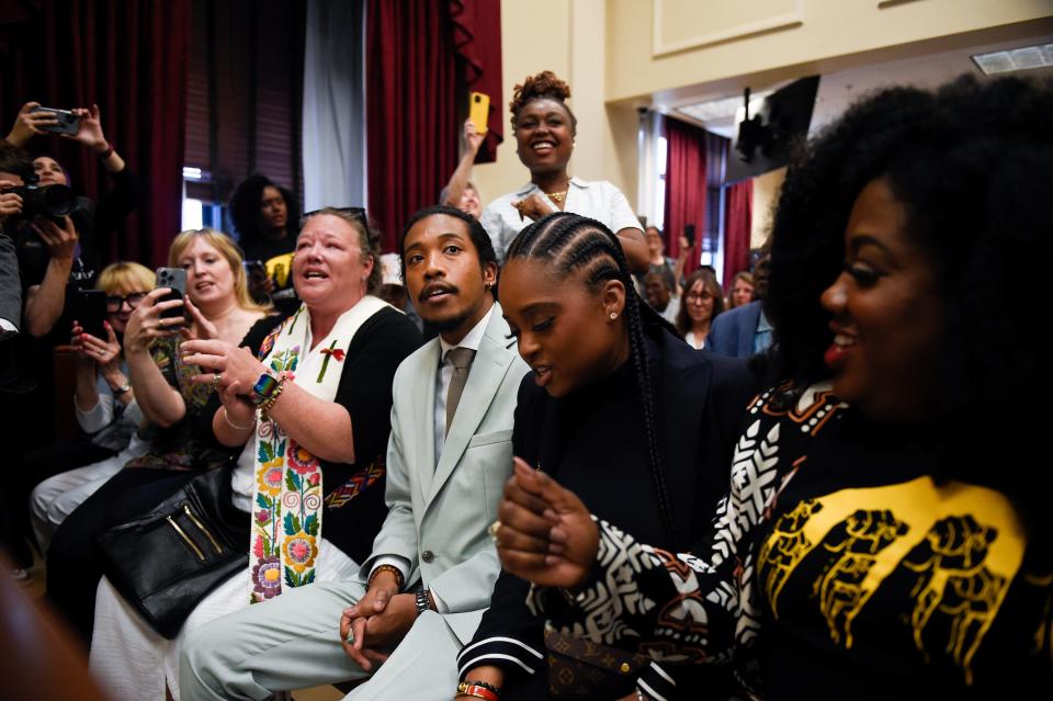 Justin Jones sits with supporters during a Metro Council meeting in Nashville on Monday, April 10, 2023. 