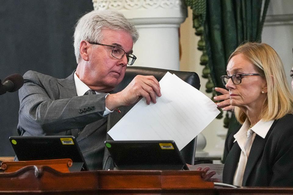 Texas Lieutenant Governor Dan Patrick hands off the second article of impeachment in the trial of Attorney General Ken Paxton at the Texas Capitol on Saturday, Sep. 16, 2023.