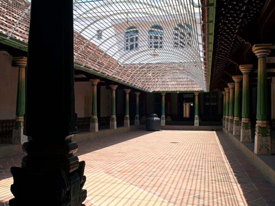 The inner courtyard is lined with pillars in a mansion in Kanadukathan in the Chettinad region