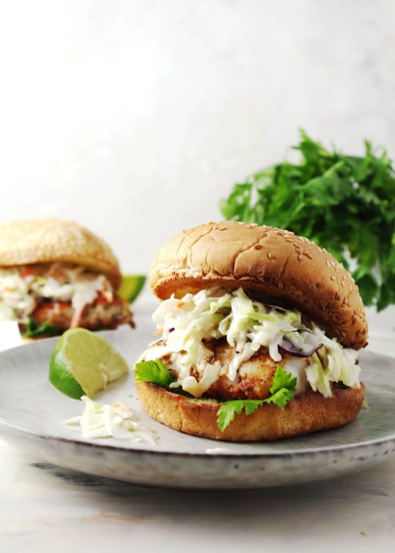 <p>Aimee Mars</p><p>Simple cod seared in a blackening spice, topped with sweet coleslaw and sandwiched between a toasted bun is a light and flavorful dish.</p><p><strong>Get the recipe: <a href="https://www.aimeemars.com/blackened-fish-sandwich/" rel="nofollow noopener" target="_blank" data-ylk="slk:Blackened Fish Burgers;elm:context_link;itc:0;sec:content-canvas" class="link "> Blackened Fish Burgers</a></strong></p>