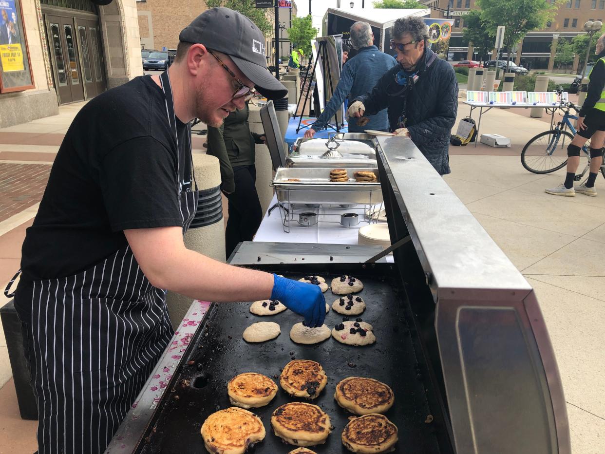 Blueberry pancakes are prepared at 2023's Michiana Bike to Work Week pancake breakfast at the Jon Hunt Memorial Plaza in South Bend.