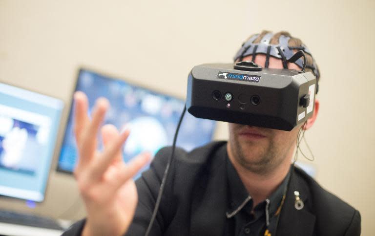 Mind Maze Software Engineer Nicolas Bourdaud demonstrates a virtual reality system at the Game Developers Conference in San Francisco, California on March 03, 2015