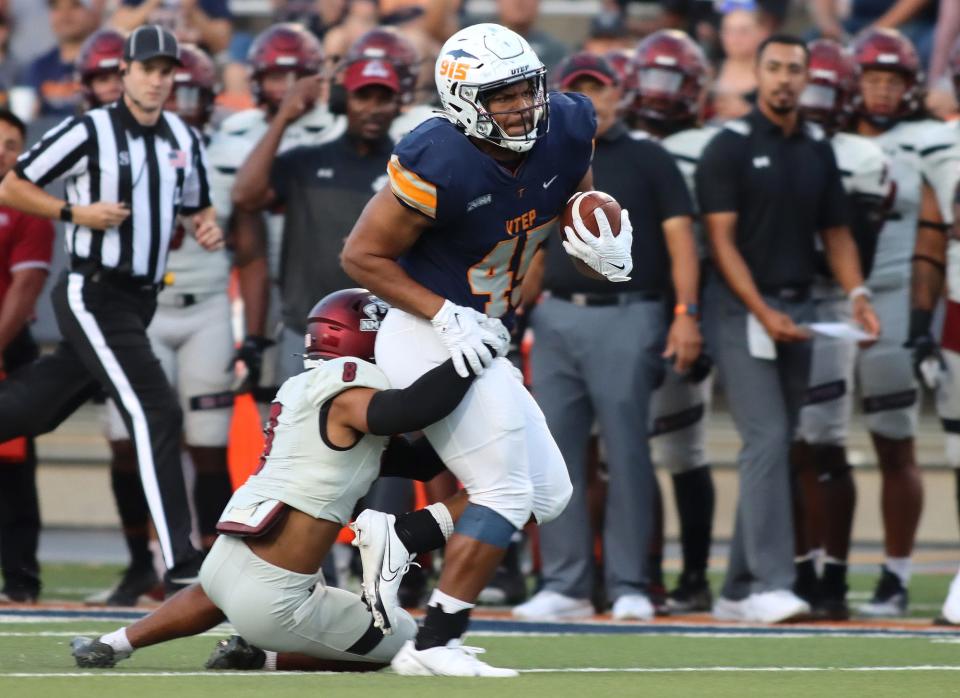 UTEP’s Trent Thompson attempts a run through the NMSU defense at the Sun Bowl Stadium on Saturday, Sept. 10, where UTEP came out on top with a final score of 20-13.