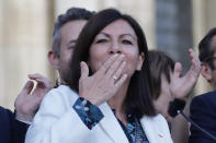 Paris mayor Anne Hidalgo blows a kiss to the audience after her victorious second round of the municipal election, Sunday, June 28, 2020 in Paris. France on Sunday held the second round of municipal elections that has seen a record low turnout amid concerns over the coronavirus outbreak and anger at how President Emmanuel Macron's government handled it. (AP Photo/Christophe Ena)