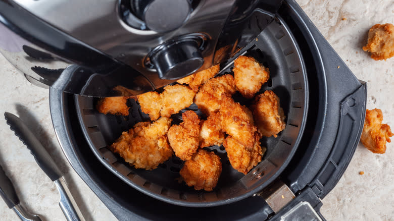 crispy chicken bites in a black air fryer