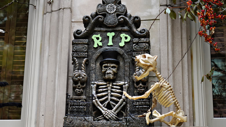 Foam gravestone with skeleton cat decoration