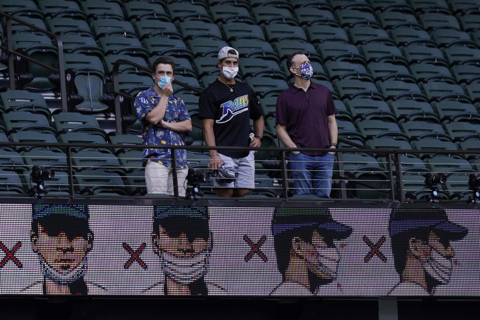 Fans watch batting practice before Game 1 of the baseball World Series between the Los Angeles Dodgers and the Tampa Bay Rays Tuesday, Oct. 20, 2020, in Arlington, Texas. (AP Photo/Eric Gay)