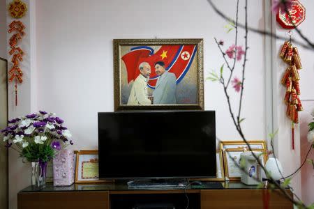 A painting depicting North Korea's leader Kim Jong-un and Vietnamese late leader Ho Chi Minh is seen at the Vietnam-North Korea Friendship kindergarten which was founded by North Korean Government in Hanoi, Vietnam February 13, 2019. REUTERS/Kham