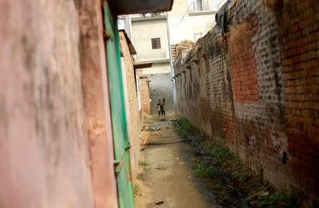 Children stand outside their house in Nayabans village in Bulandshahr district, Uttar Pradesh, India December 5, 2018. REUTERS/Adnan Abidi