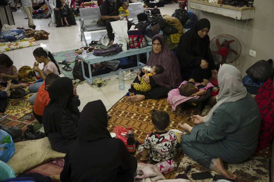 Palestinians take shelter in a hospital during ongoing Israeli bombardment in Khan Younis, Gaza Strip, Friday, Oct. 27, 2023. (AP Photo/Fatima Shbair)