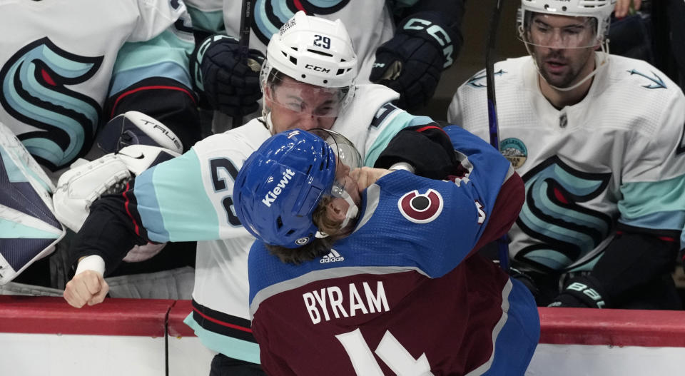 Seattle Kraken defenseman Vince Dunn (29) fights with Colorado Avalanche defenseman Bowen Byram (4) in the third period of an NHL hockey game Thursday, Nov. 9, 2023, in Denver. (AP Photo/David Zalubowski)