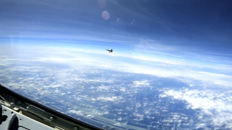 FILE - In this image from video provided by the U.S. Navy, a Chinese J-16 fighter fliess aggressively close to a U.S. RC-135 aircraft flying in international airspace over the South China Sea on May 26, 2023. (U.S. Navy via AP, File)