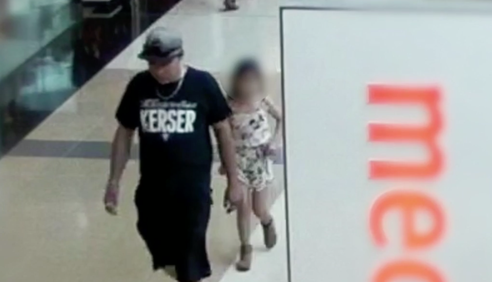 CCTV footage shows Free leading the girl from Kmart. Source: Nine News