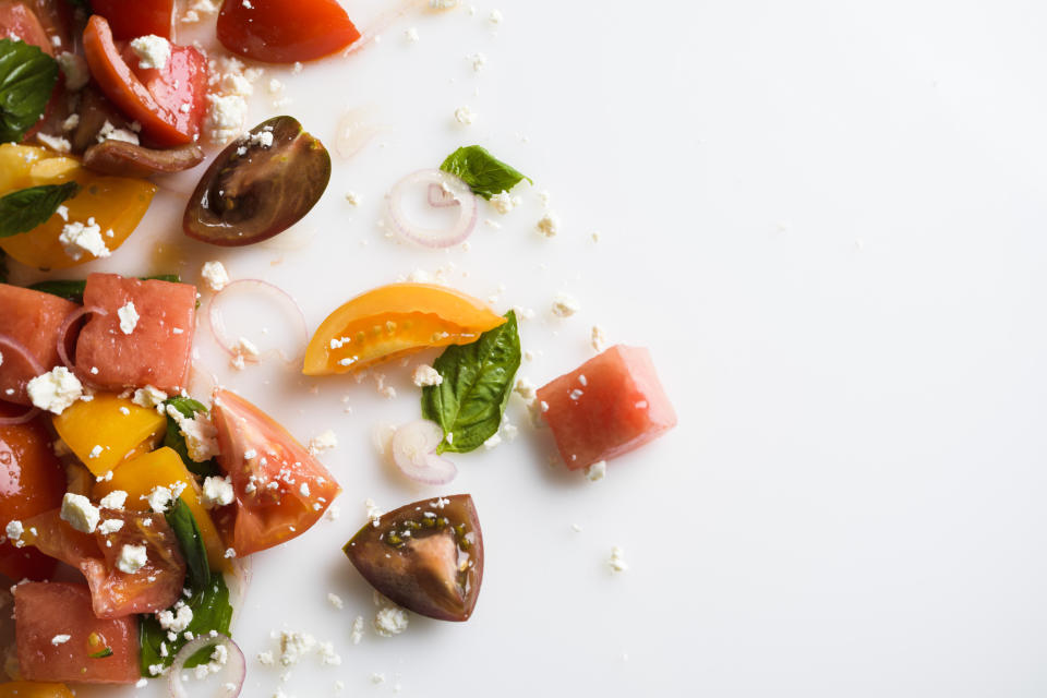 This image released by Milk Street shows a recipe for watermelon salad with tomato, basil and goat cheese. (Milk Street via AP)