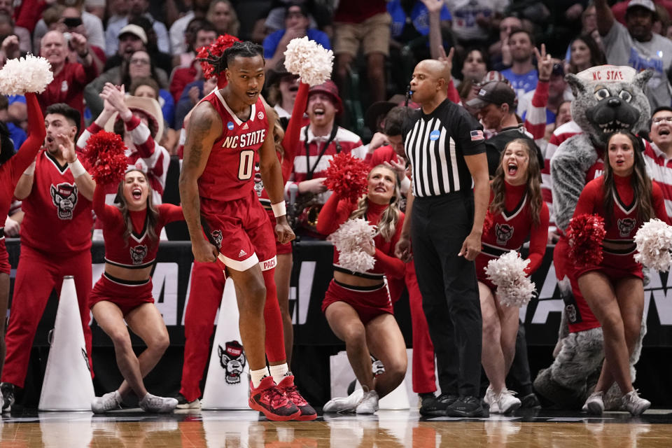 North Carolina State's DJ Horne (0) reacts after a basket against Duke during the second half of an Elite Eight college basketball game in the NCAA Tournament in Dallas, Sunday, March 31, 2024. (AP Photo/Tony Gutierrez)