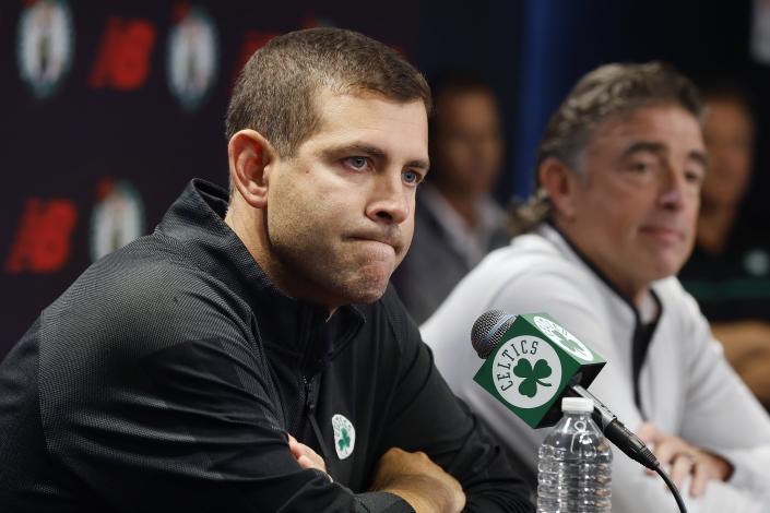 Boston Celtics president of basketball operations Brad Stevens speaks beside owner Wyc Grousbeck, right, during a news conference, Friday, Sept. 23, 2022, in Boston. The Celtics suspended coach Ime Udoka for the upcoming season after a months-long investigation by an external law firm that found multiple violations of team policies. (AP Photo/Michael Dwyer)