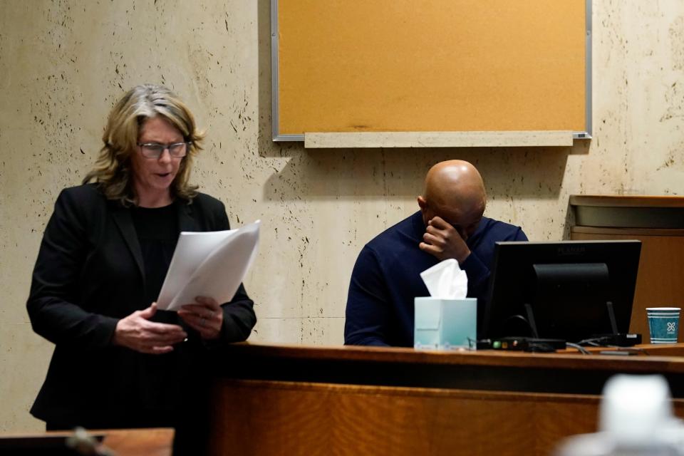 Robert Ray, brother of James Ray III, wipes his eyes while assistant prosecutor Michele Miller questions him on the first day of the James Ray III murder trial in Newark, Wednesday, March 29, 2023. Ray is charged with murdering his girlfriend, Angela Bledsoe, in the Montclair home they shared in 2018.