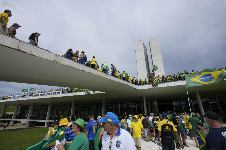 FILE - Protesters, supporters of Brazil's former President Jair Bolsonaro, storm the National Congress building in Brasilia, Brazil, Sunday, Jan. 8, 2023. (AP Photo/Eraldo Peres, File)