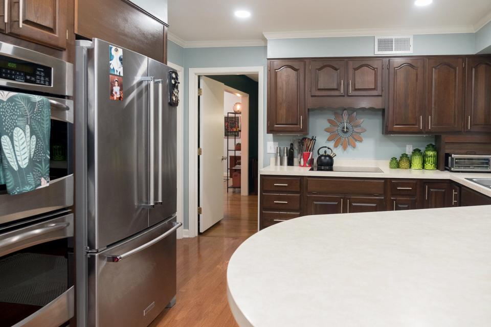 With the exception of the updated stainless-steel appliances and the new paint scheme, the kitchen appears much as it did in 1955 when the home was built.