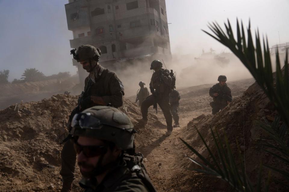 Israeli soldiers take up positions during a ground operation in Khan Younis, Gaza Strip (AP)