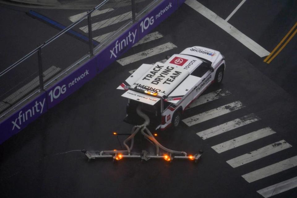 Jul 2, 2023; Chicago, Illinois, USA; Crews work on drying the track during a weather delay in The Loop 121 of the Chicago Street Race viewed from the eRacing Association turn 7 Skydeck at Venue Six10. Mandatory Credit: Jon Durr-USA TODAY Sports