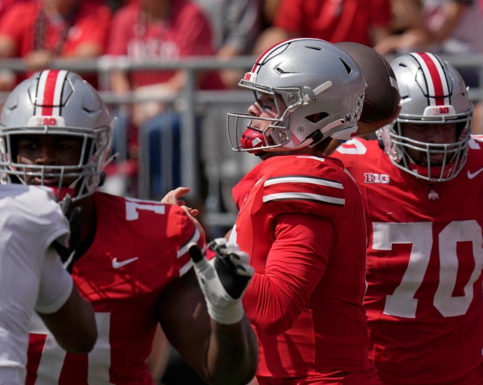 Ohio State quarterback Kyle McCord completed 14 of 20 passes for 258 passing yards and three touchdowns on Saturday.