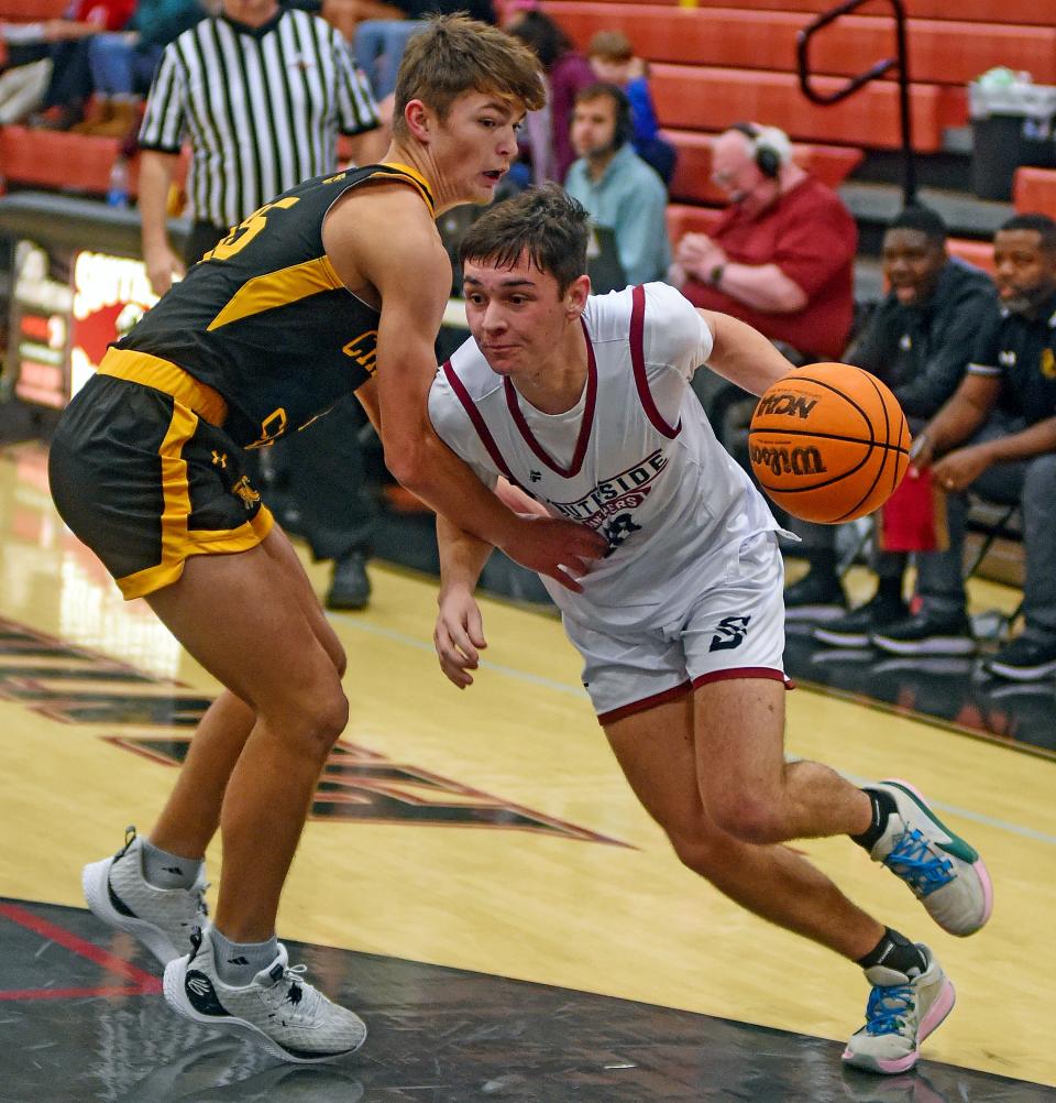 SouthsideÕs Cayden Reason drives to the basket as Cherokee CountyÕs Haden Wheeler defends during high school basketball action in Southside, Alabama December 22, 2023. (Dave Hyatt: The Gadsden Times)