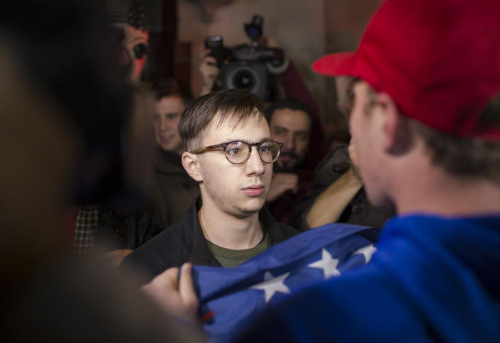 <p>An anti-Trump protester (center) confront a Donald J. Trump supporter (right) across the street from the Hilton Hotel where the Republican Presidential nominee is holding his victory celebration at the Hilton Hotel on November 9, 2016 in New York City. (Photo: Robert Nickelsberg/Getty Images) </p>