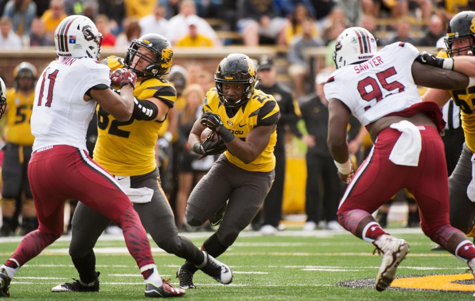 Missouri running back Ish Witter, center, runs against South Carolina behind the block of Clayton Echard during a game Oct. 3, 2015, at Faurot Field.