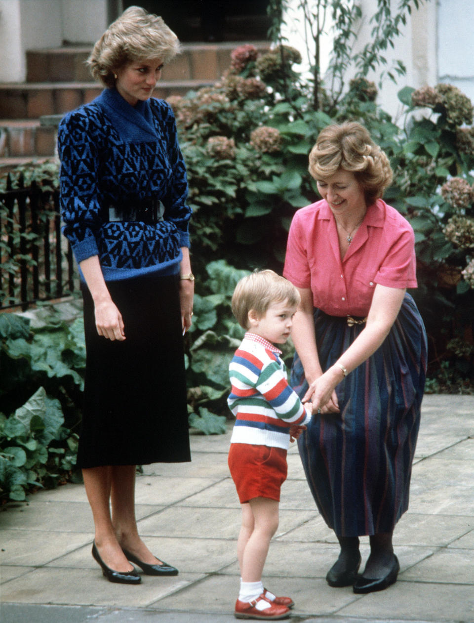 Diana, The Princess of Wales looks on as Mrs. Jane Mynors greets Prince William at the Victorian terrace house on his first day at Jane Mynors nursery school in London   (Photo by PA Images via Getty Images)