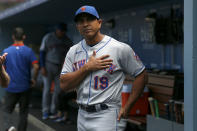 FILE - New York Mets manager Luis Rojas talks with a fan before a baseball game against the Los Angeles Dodgers in Los Angeles, in this Sunday, Aug. 22, 2021, file photo. Luis Rojas was let go as manager of the New York Mets on Monday, Oct. 4, 2021, after two losing seasons. The team declined its option on Rojas’ contract for 2022, making the announcement a day after finishing third in the NL East at 77-85 in Steve Cohen’s first year of ownership. (AP Photo/Alex Gallardo, File)