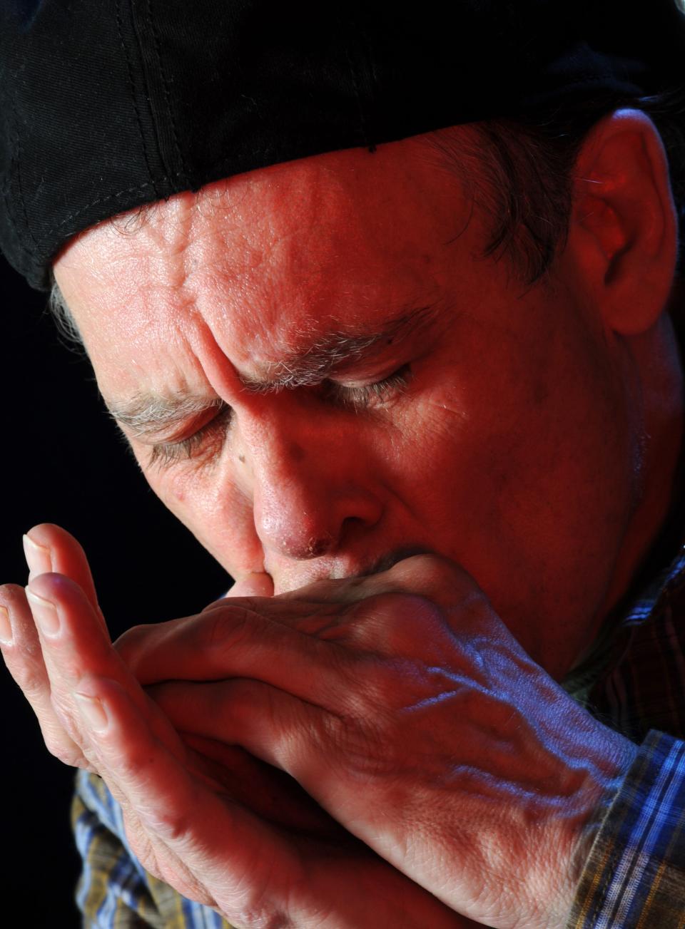 Greg "Fingers" Taylor, photographed at the Clarion Ledger on March 10, 2010, played harmonica in Jimmy Buffet's Coral Reefer Band for 32 years. Taylor, who retired in 2010 and returned home to live in Mississippi, died on Nov. 23.