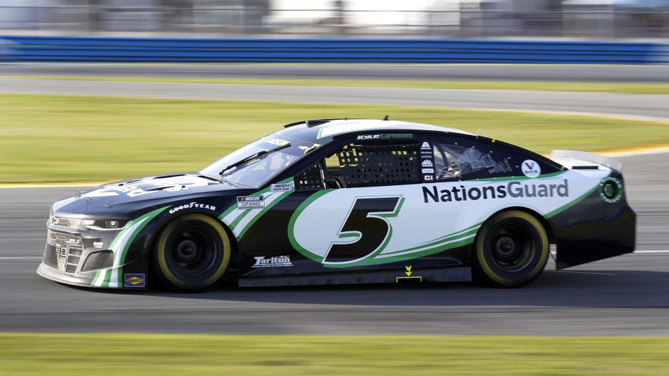 Kyle Larson (5) comes out of a turn during the NASCAR Cup Series road-course auto race at Daytona International Speedway, Sunday, Feb. 21, 2021, in Daytona Beach, Fla. (AP Photo/John Raoux)