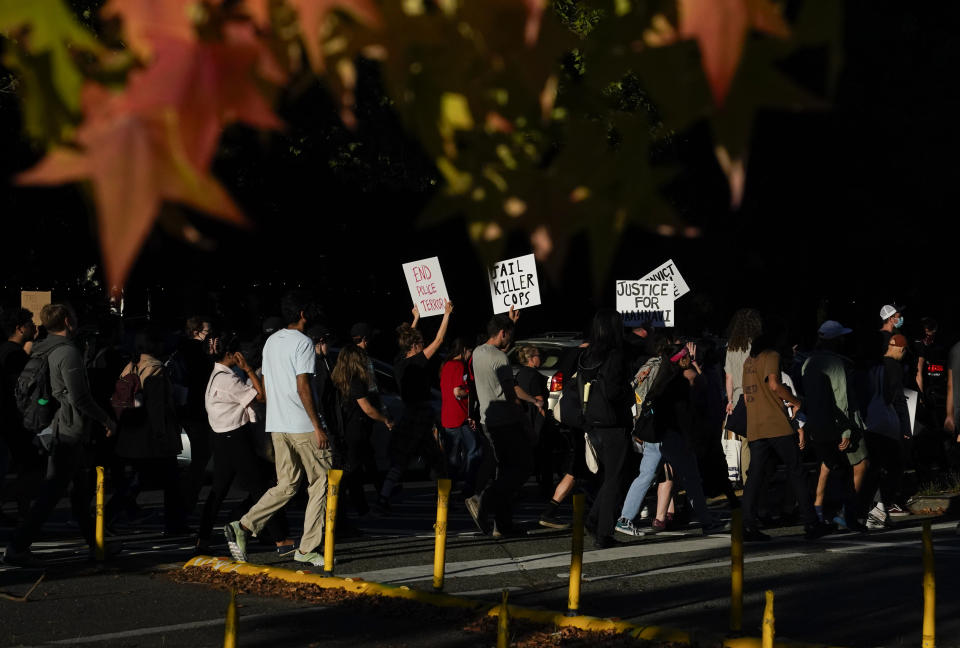 Protesters march after body camera footage was released of a Seattle police officer joking about the death of Jaahnavi Kandula, a 23-year-old woman hit and killed in January by officer Kevin Dave in a police cruiser, Thursday, Sept. 14, 2023, in Seattle. (AP Photo/Lindsey Wasson)