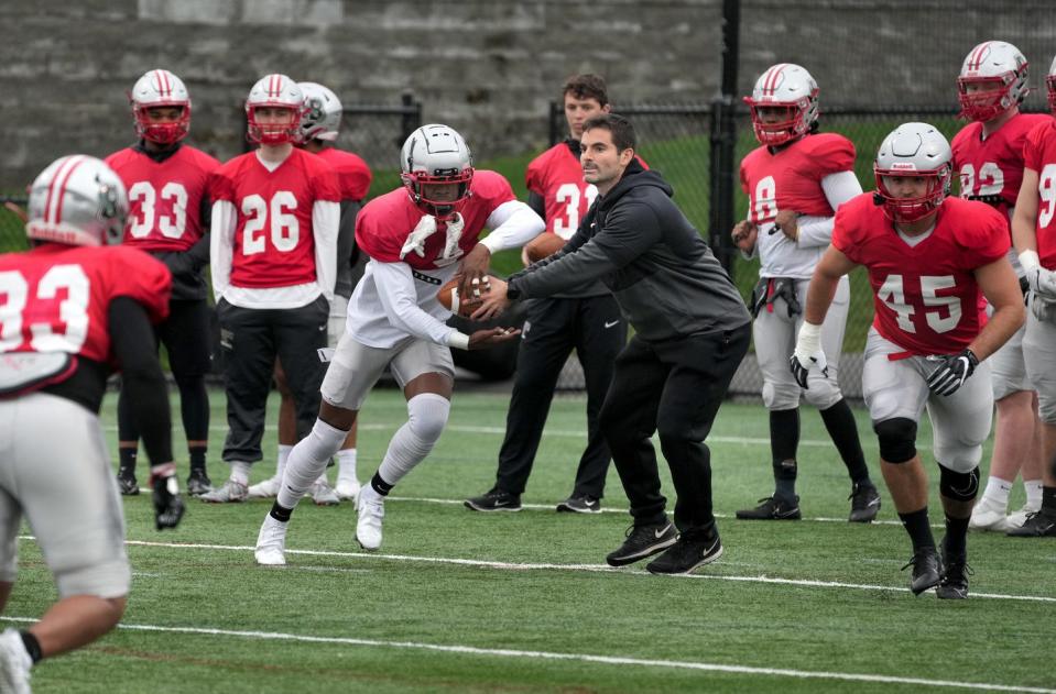 Players run through a drill during Brown's spring practice on Tuesday afternoon.