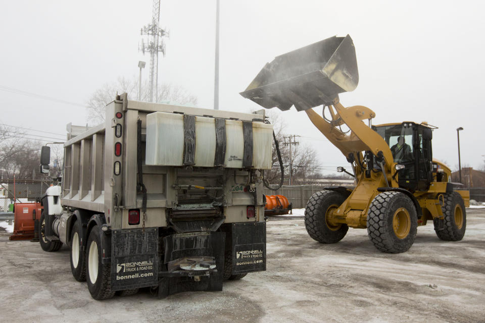 Road salt is loaded into a snow plow truck equipped with a salt spreader at the public works facility in Glen Ellyn, Ill., on Tuesday, Feb. 4, 2014. The Midwest's recent severe winter weather has caused communities to expend large amounts of their road salt supplies. (AP Photo/Andrew A. Nelles)