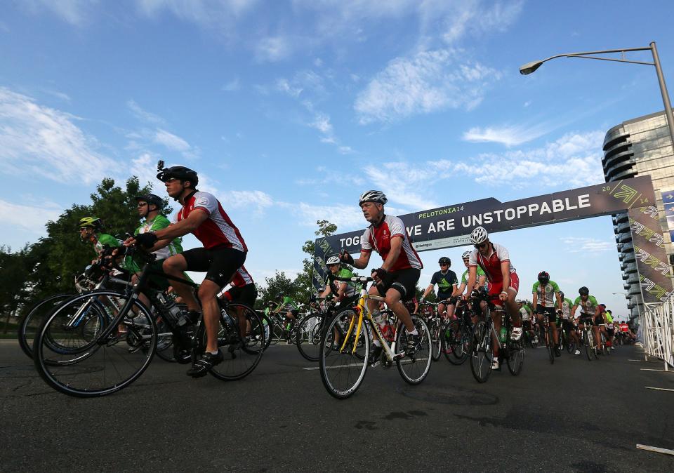 The first group of bicyclists take off from the Pelotonia start at the McFerson Commons in 2014.