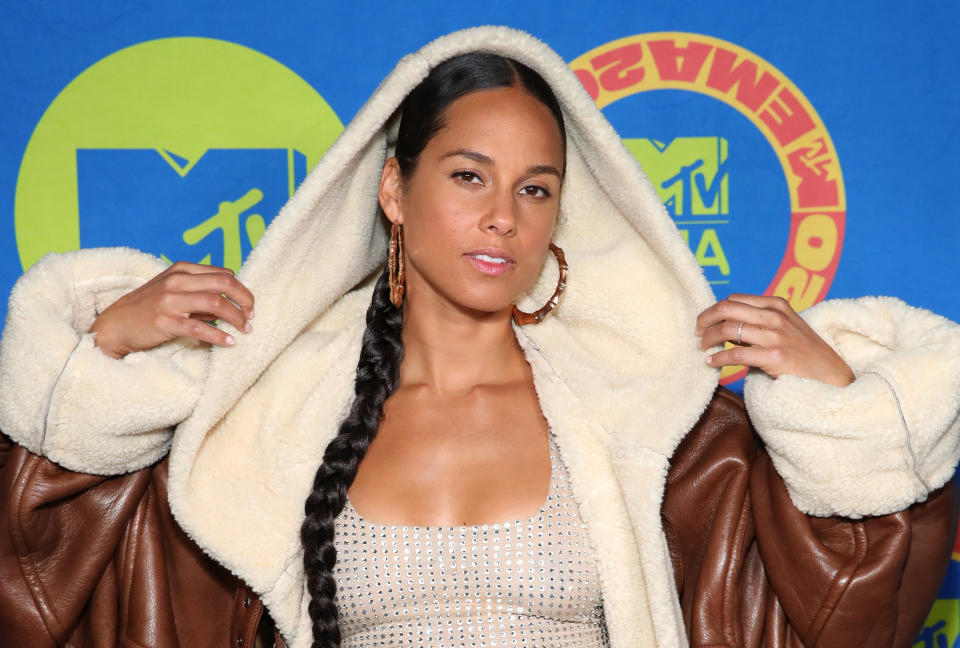 Photo of Alicia Keys in a fuzzy jacket