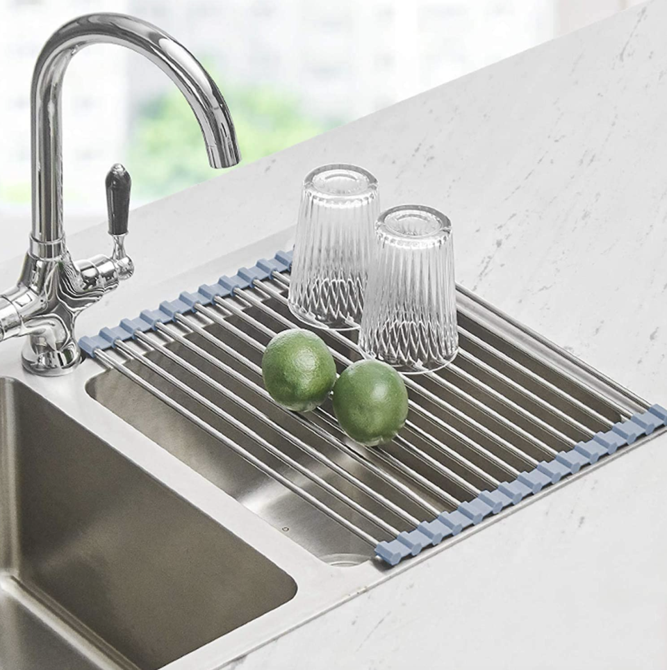 Seropy Foldable Sink Mat on sink with limes and cups on top (Photo via Amazon)